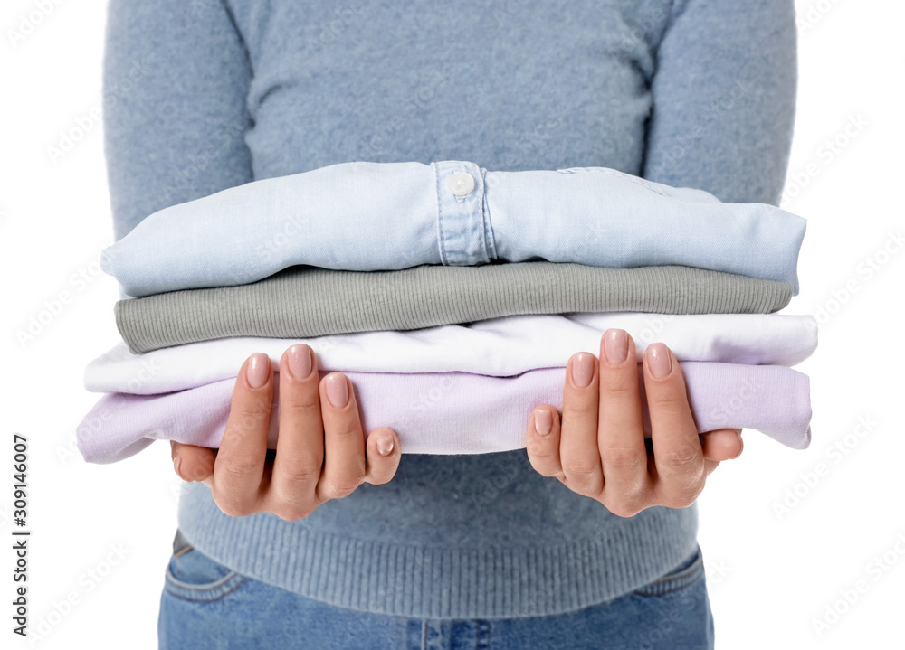 Young woman with clean clothes on white background, closeup