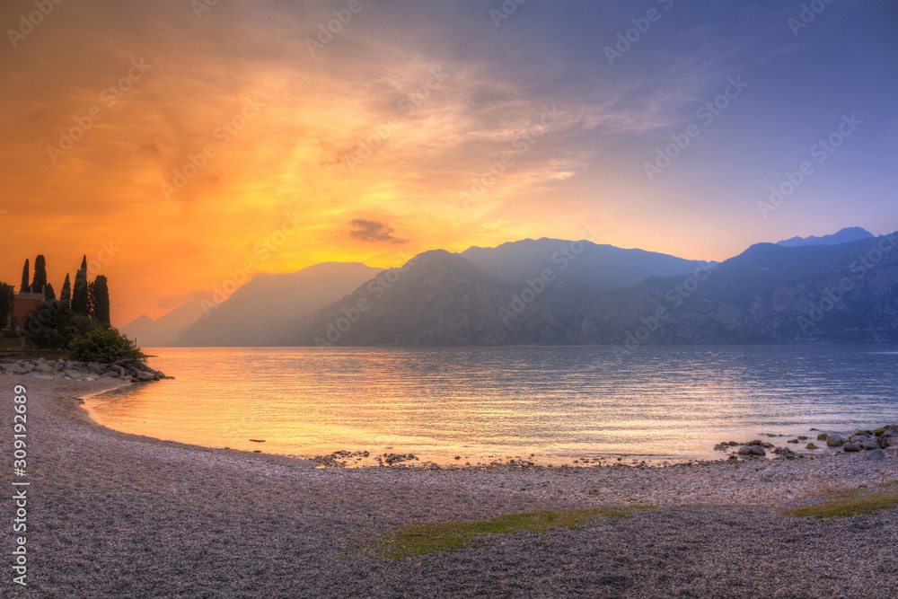 Beautful coastline of Garda lake at sunset, northern Italy