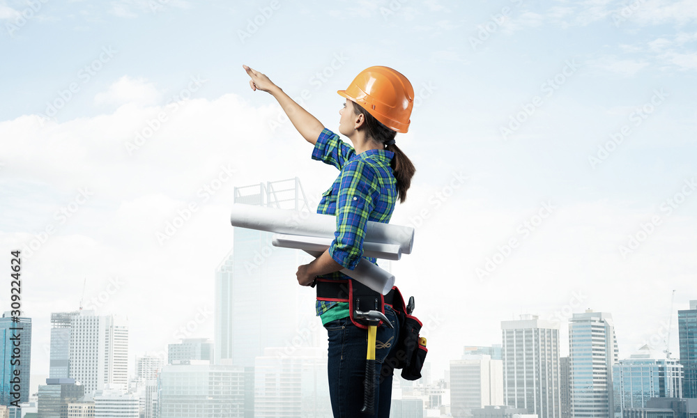 Woman architect in checkered blue shirt