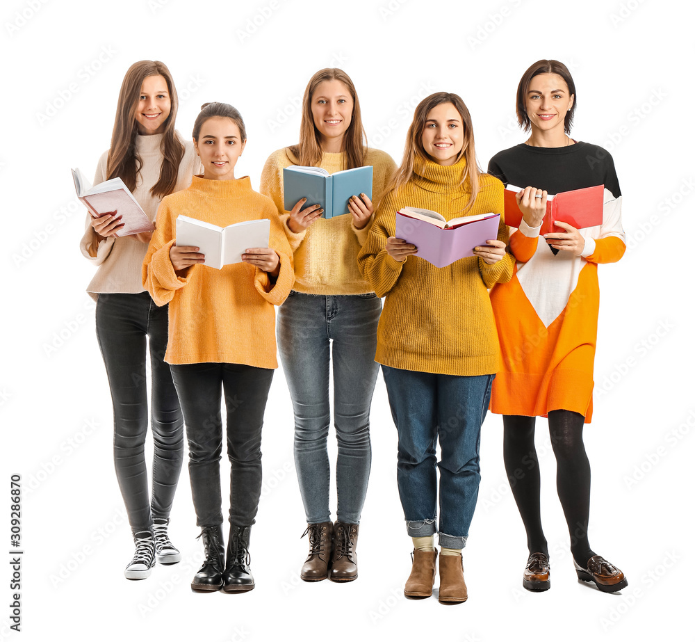 Young women with books on white background