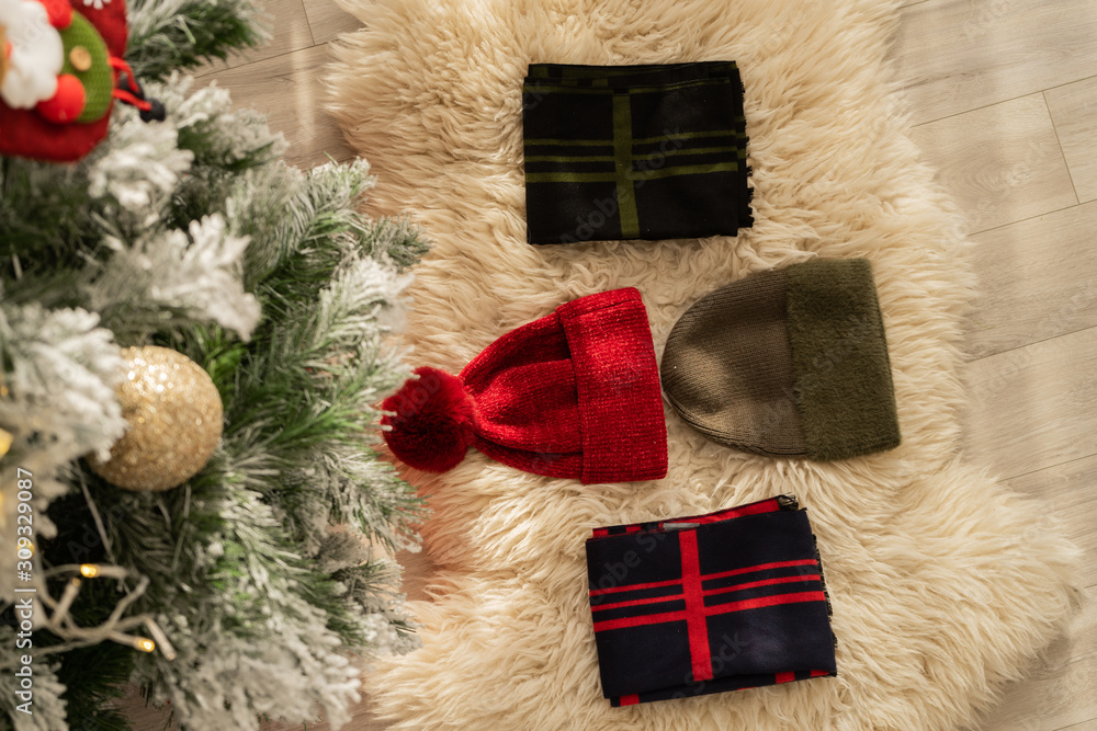 christmas stocking with gifts on wooden background