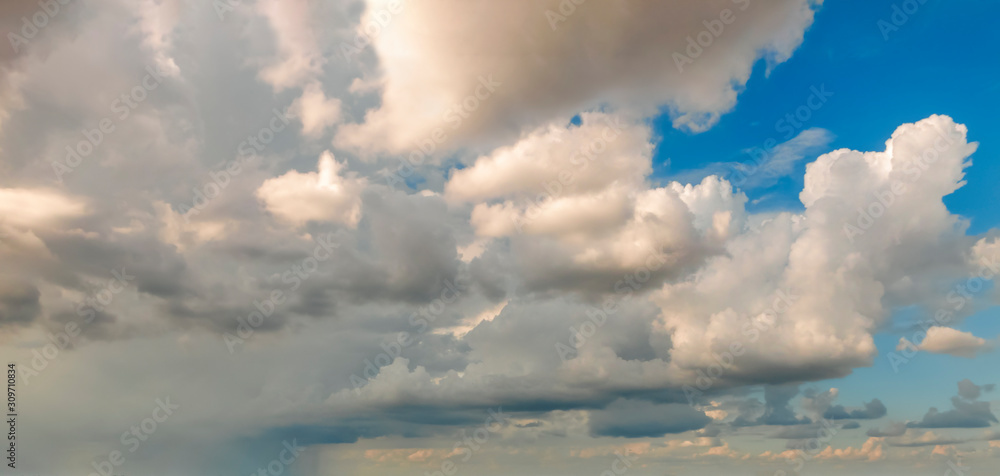 Blue sky background with white dramatic clouds