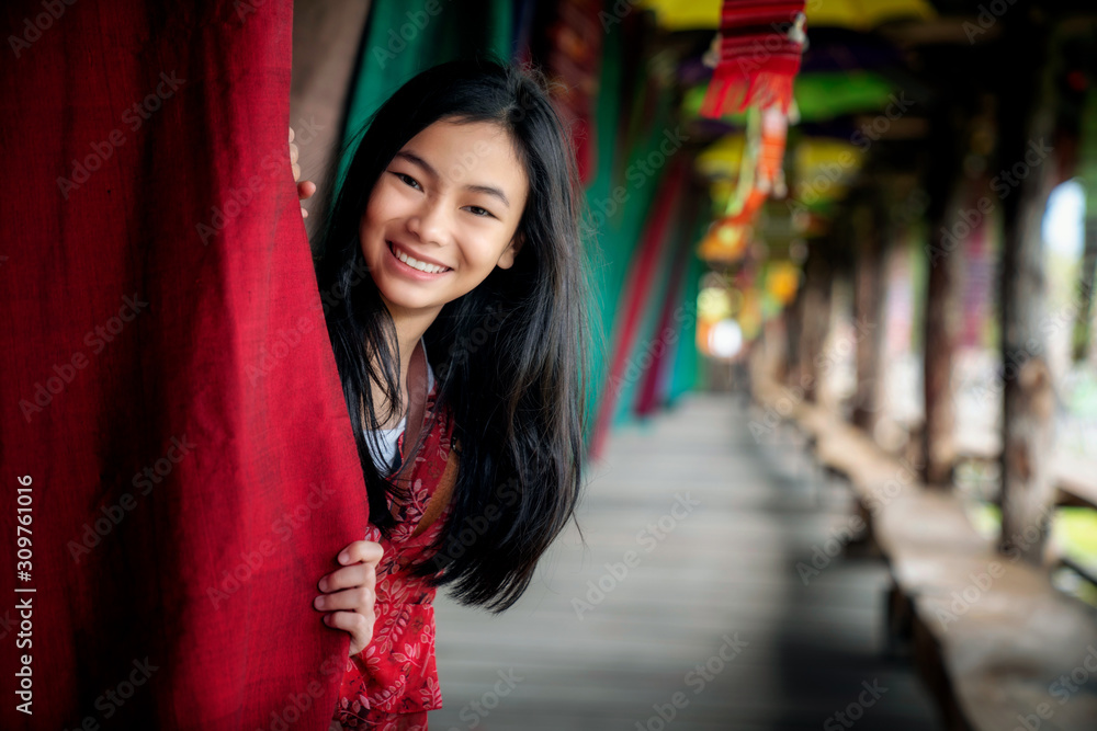 Asian girl fun and play in Lamduan woven cloth coffee shop