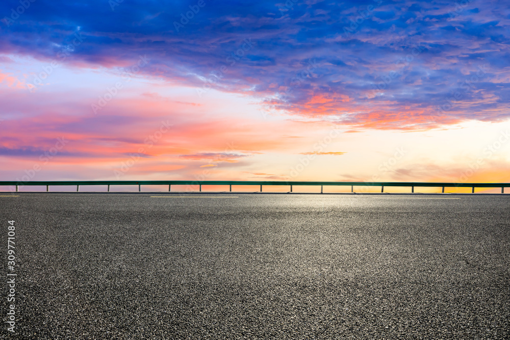 Empty asphalt road and beautiful clouds landscape at sunset.