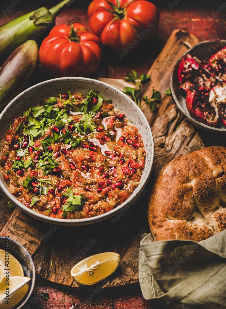 Turkish, Middle East traditional meze starter. Babaganoush cold dip in bowl seasoned with parsley, p