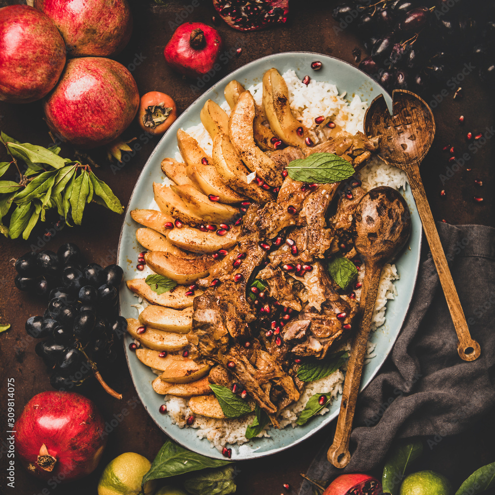 Turkish traditional meat dish. Flat-lay of roasted lamb chops with quince and rice pilav over rustic