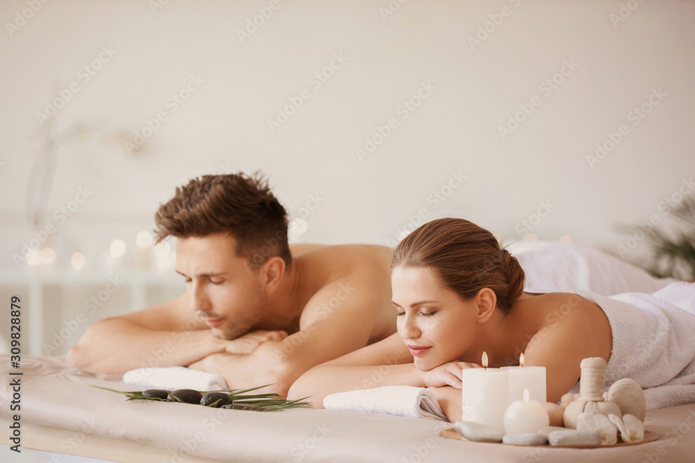 Young couple relaxing in spa salon