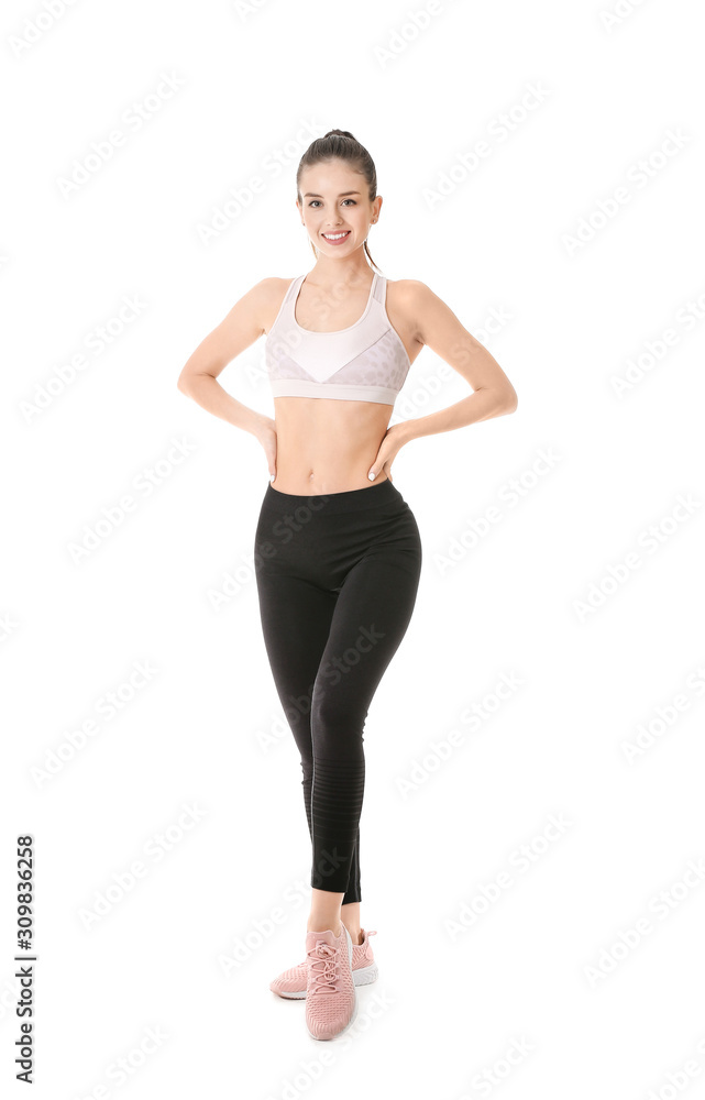 Sporty young woman on white background