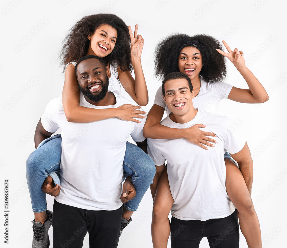 Portrait of young African-American people on white background