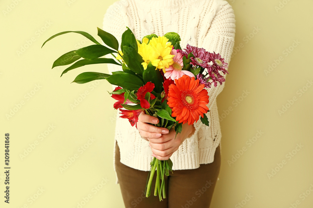 Florist with beautiful bouquet on color background