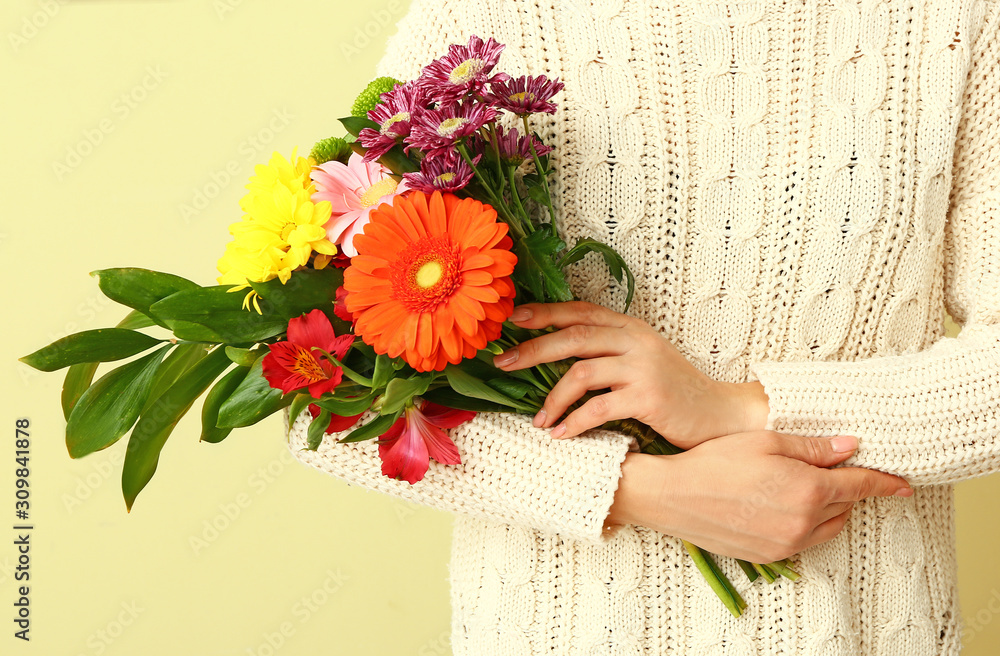 Florist with beautiful bouquet on color background