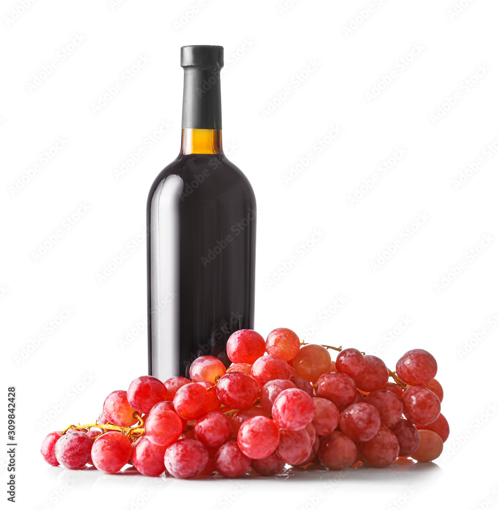 Bottle of wine and grapes on white background