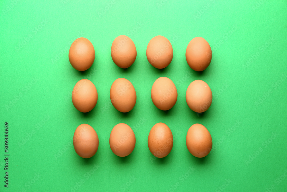 Fresh eggs on color background