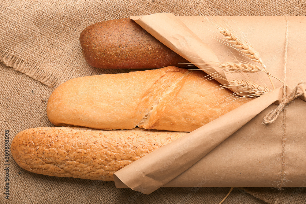 Assortment of fresh bread wrapped in paper