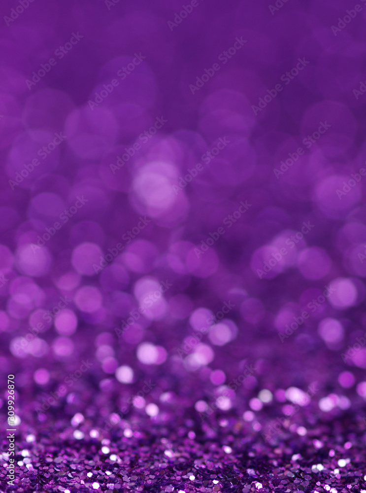 Purple glitter lights background. defocused