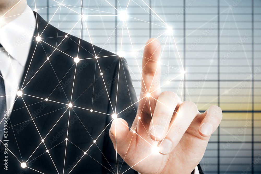 Businessman hand touches polygons backdrop