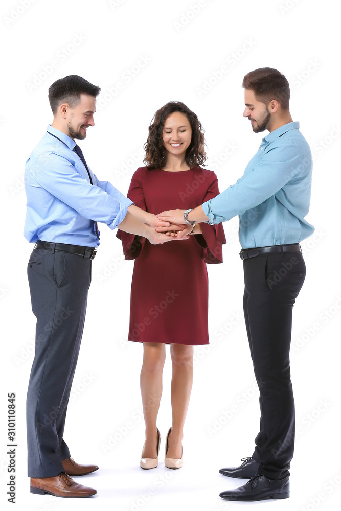 Young business people putting hands together on white background