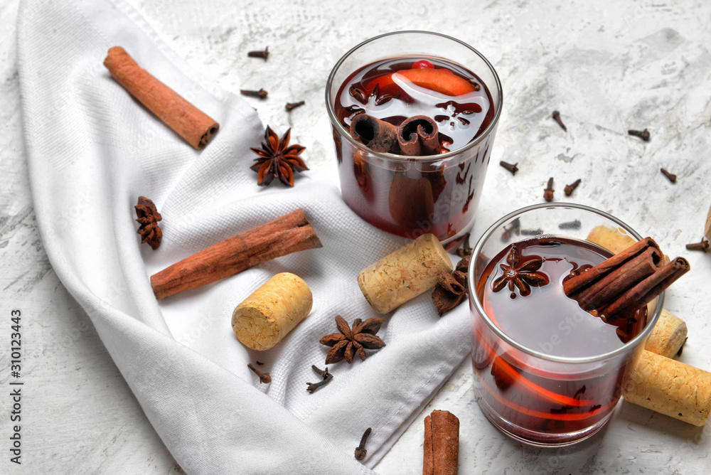 Glasses of tasty mulled wine on table