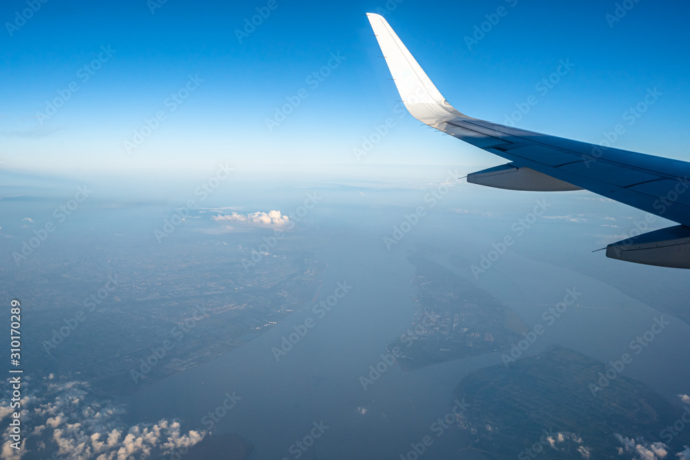 airplane with dalian city skyline