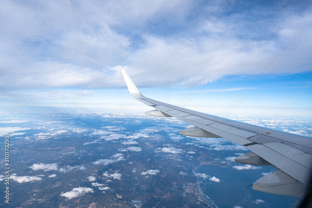 airplane with dalian city skyline