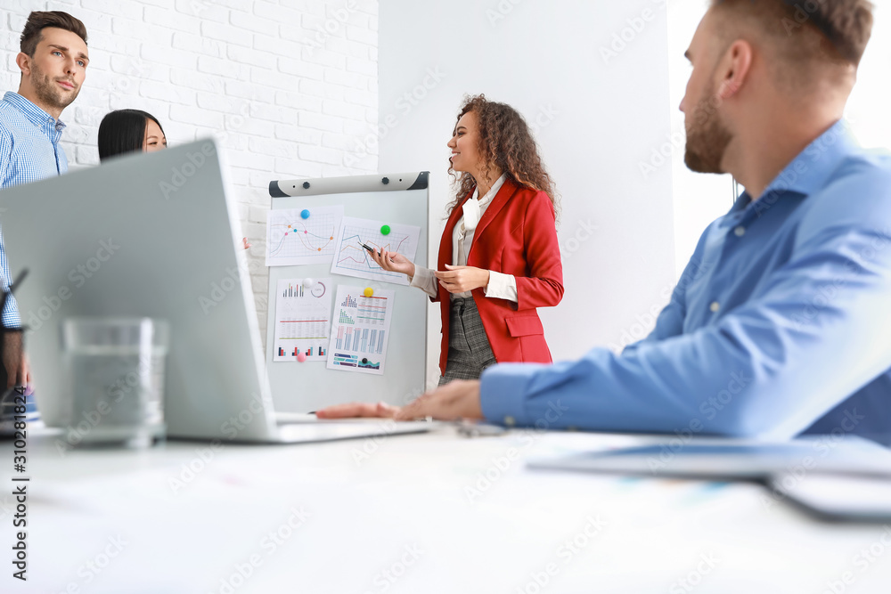 Colleagues discussing issue at business meeting in office