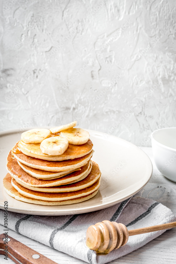 cooked pancake on plate at wooden background