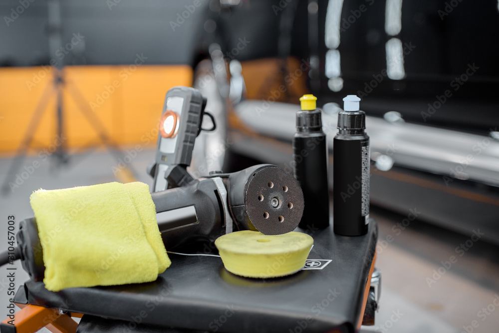 Professional equipment for automotive body polishing at the car service. Car detailing tools for veh