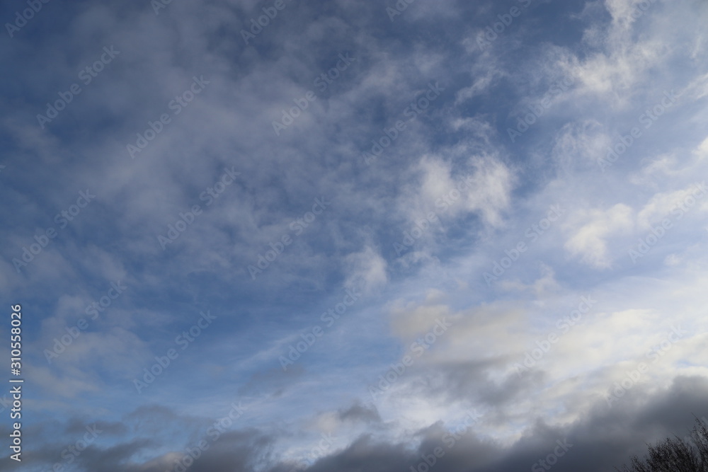 Detailed mixed clouds formations on a deep blue sky shot in northern europe