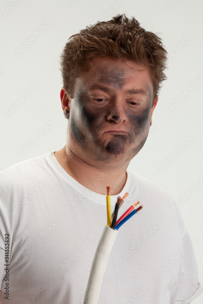 Man looking to wires. His face smoked