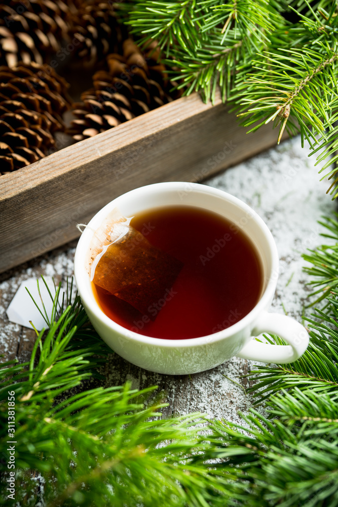 Cup of tea with forest decorations. Selective focus. Shallow depth of field.