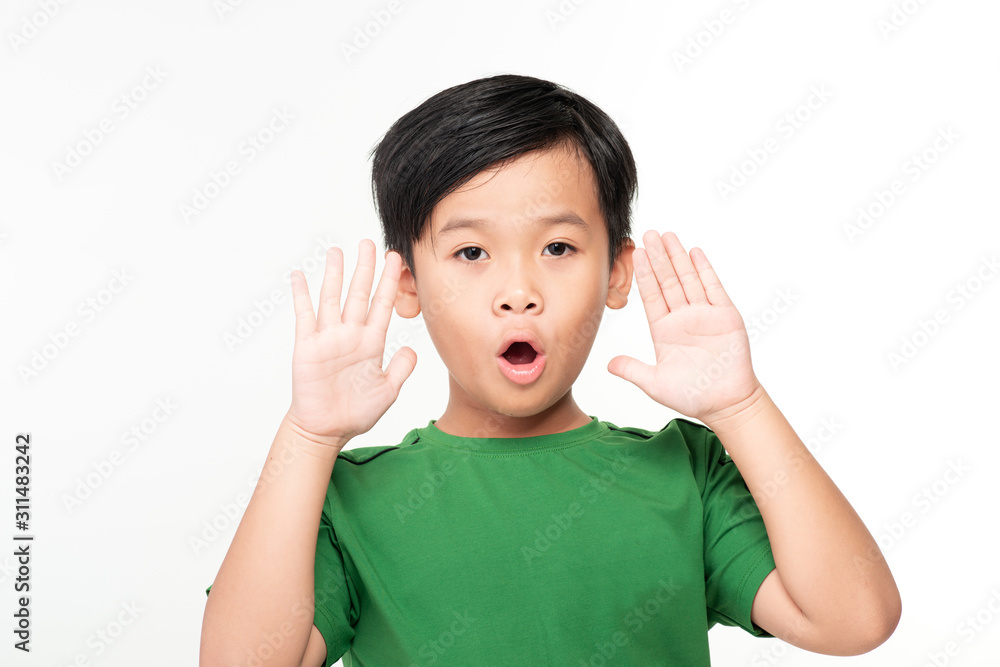 Cute asian schoolboy laughing and screaming isolated on white background.