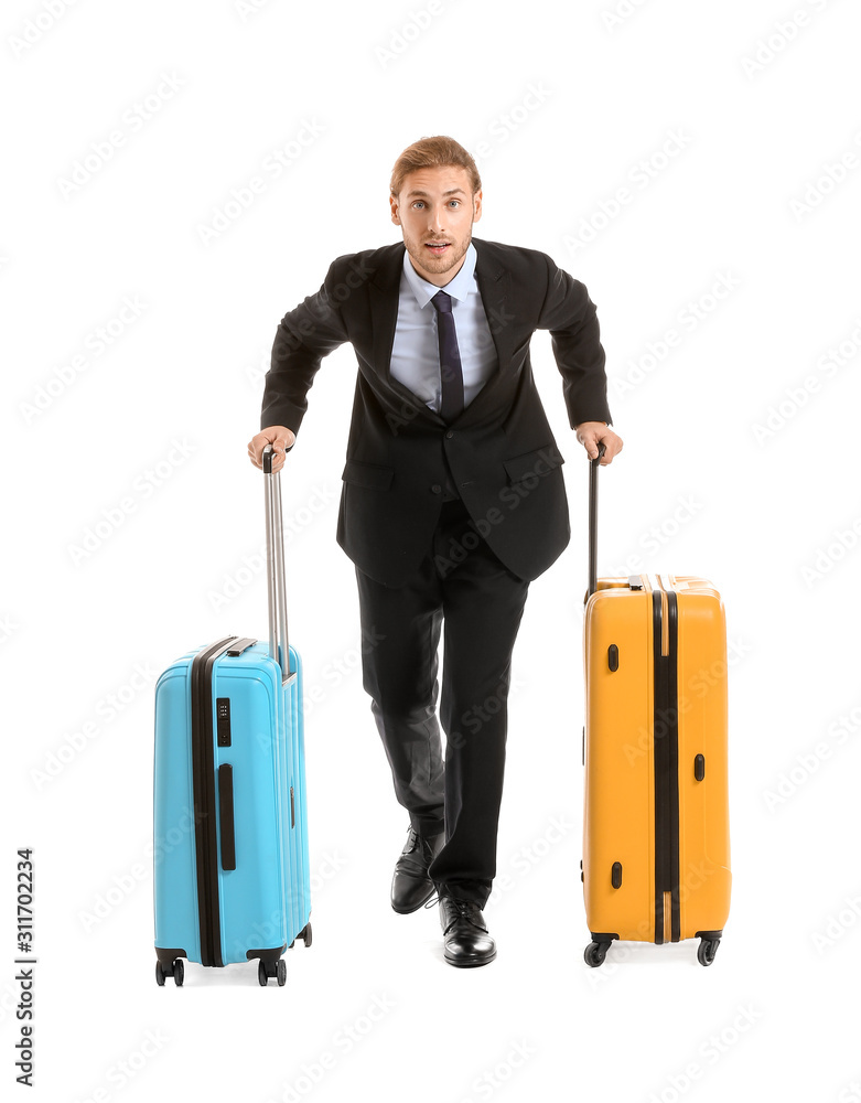 Young businessman with luggage isolated on white