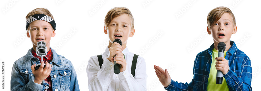 Surprised little boy with microphone against white background