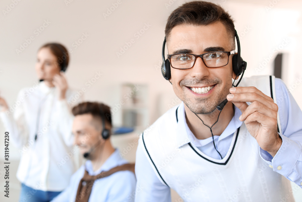 Male technical support agent working in office