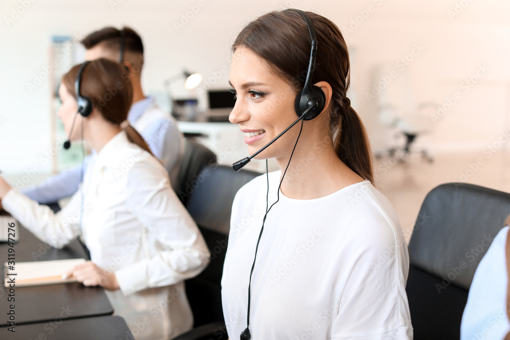 Female technical support agent working in office