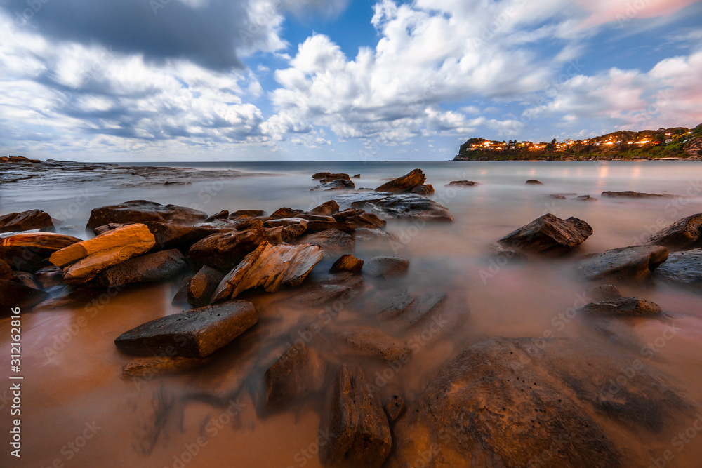 Sydney beach sunset with rock pools