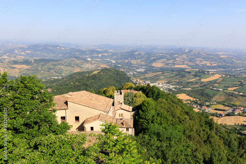 Old town of San Marino with the hilly landscape in the background