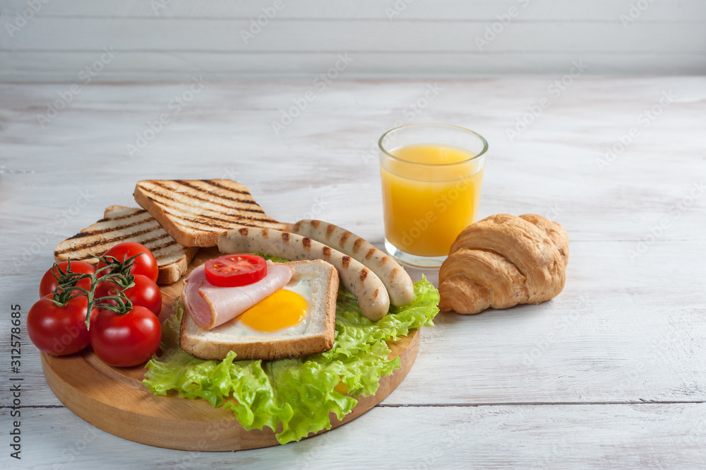 Fried sausage with eggs and vegetables