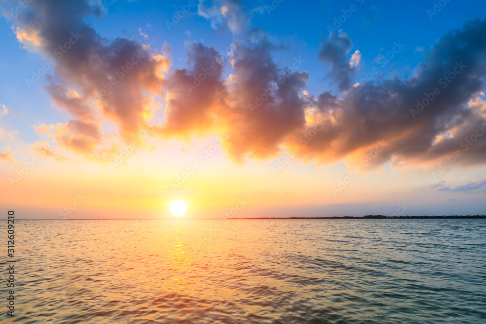 Dreamy sunset landscape by the lake