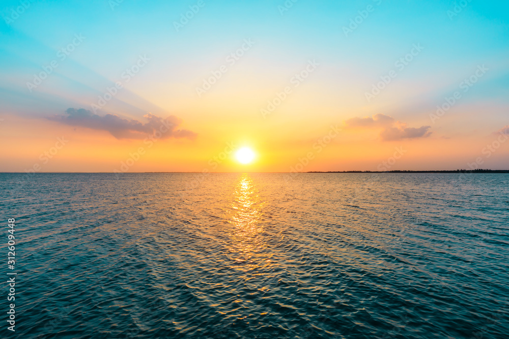 Dreamy sunset landscape by the lake