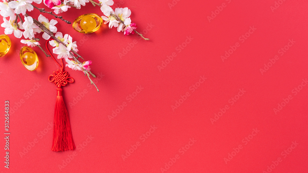 Design concept of Chinese lunar new year - Beautiful Chinese knot with plum blossom isolated on red 