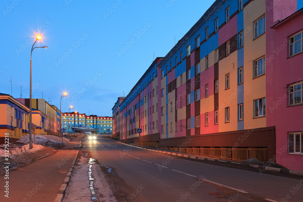 Beautiful night street cityscape with colorful residential buildings. Bright spring nights in the fa