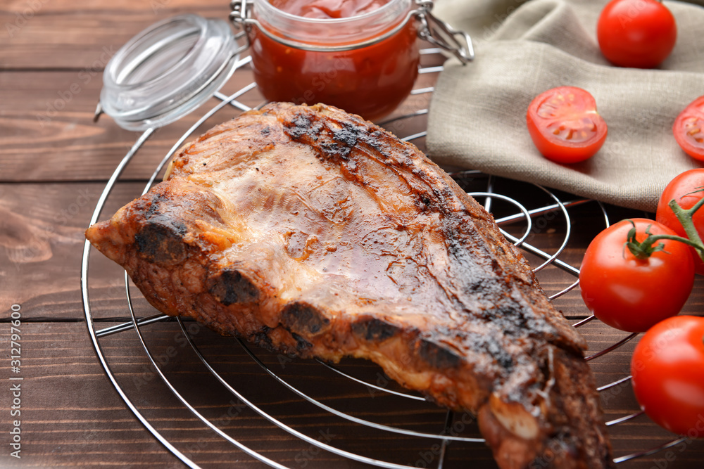 Meat with tasty barbecue sauce on table