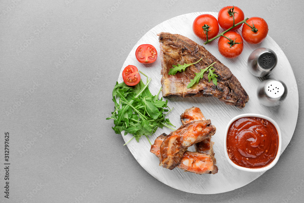 Composition with tasty barbecue sauce and meat on table