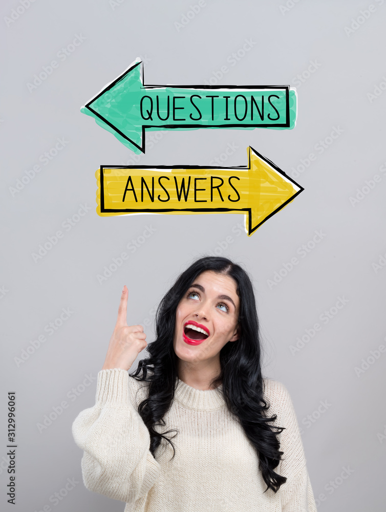 Questions and answers with happy young woman on a gray background