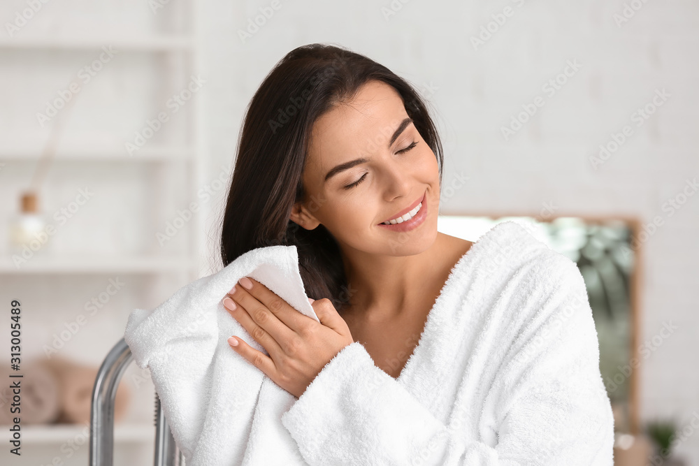 Beautiful young woman after taking bath at home