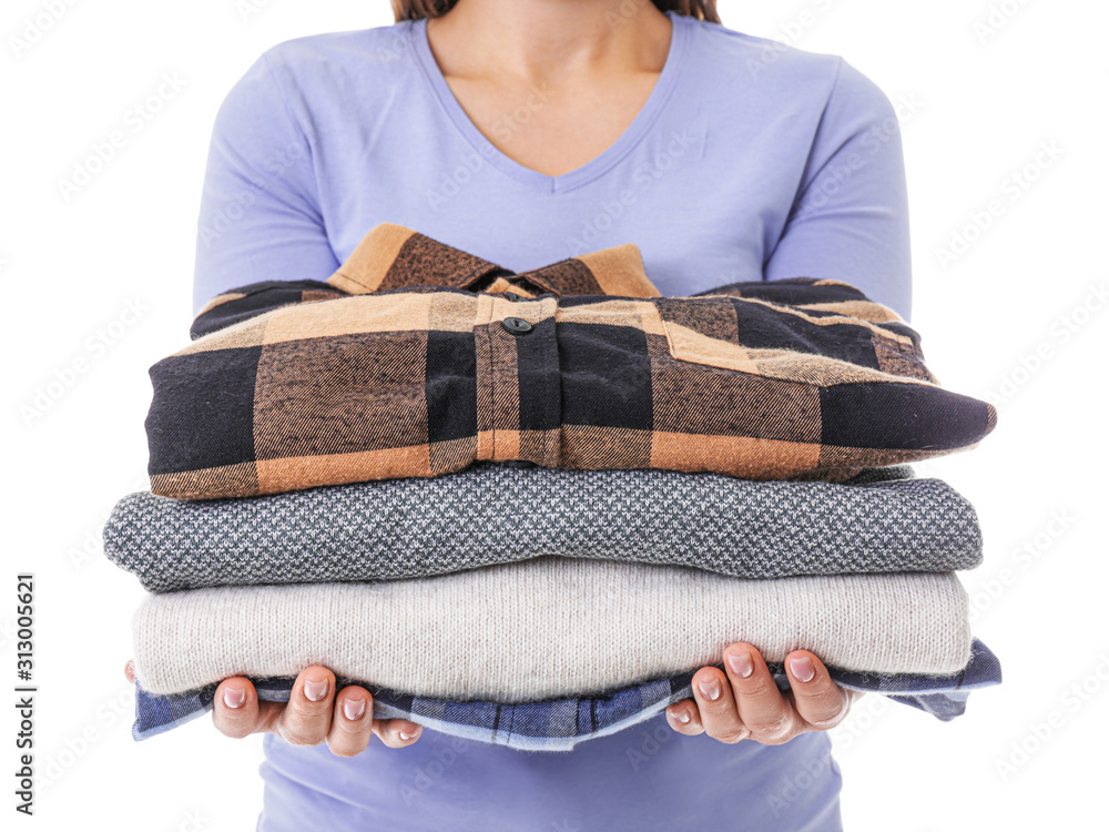 Young woman with clean laundry on white background, closeup