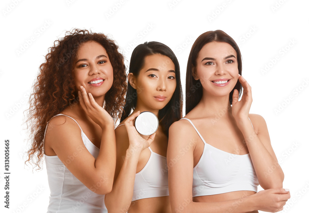 Beautiful young women with cream on white background