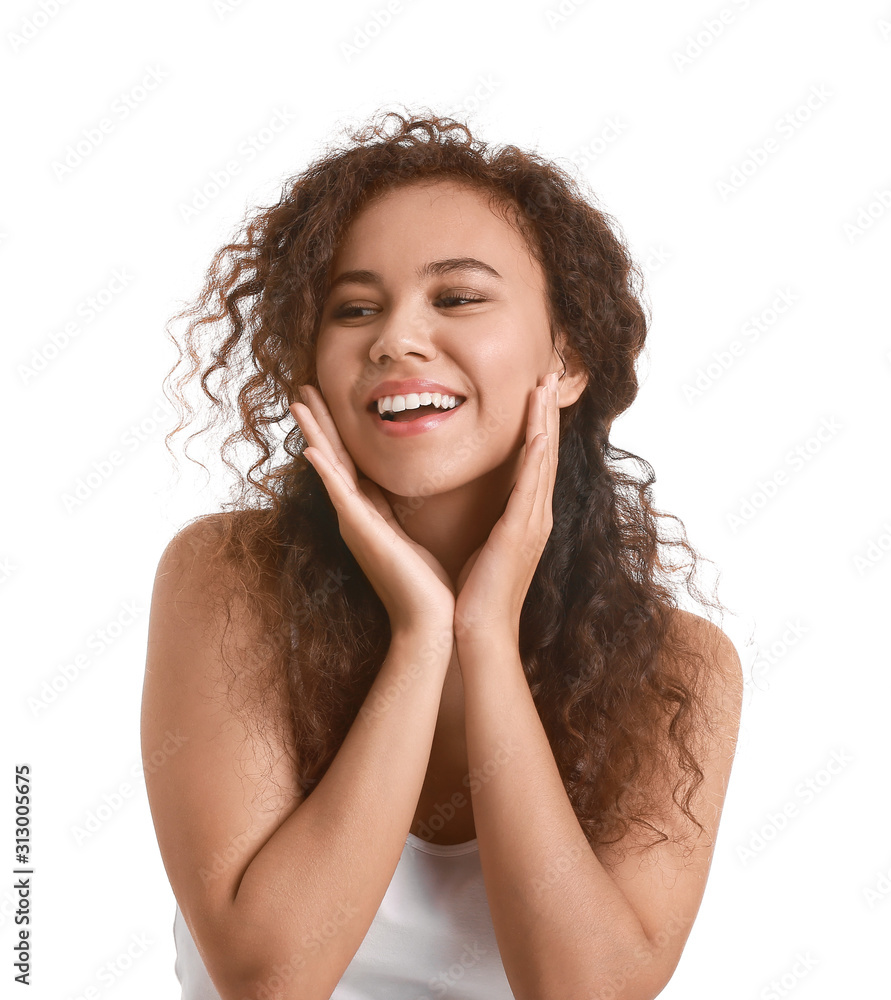 Beautiful young African-American woman with healthy skin on white background