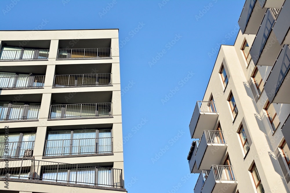 Modern apartment buildings on a sunny day with a blue sky. Facade of a modern apartment building.